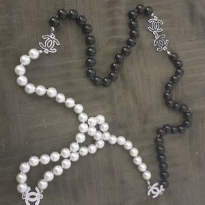 A chanel tri- color pearl necklace.